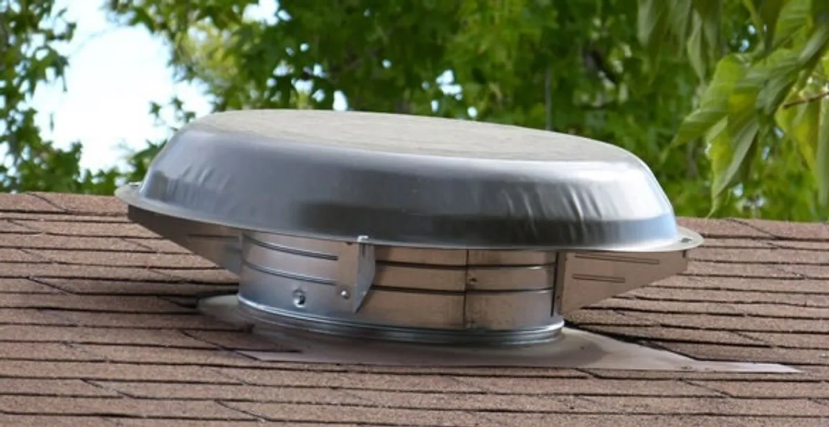 attic fan installation services with low-profile roof ventilation unit in Fort Wayne, IN